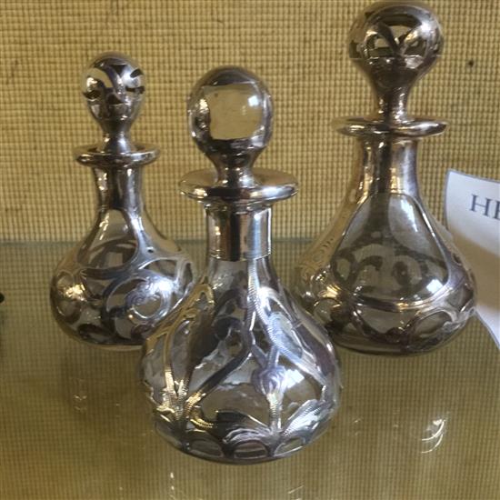 Three silver overlaid scent bottles